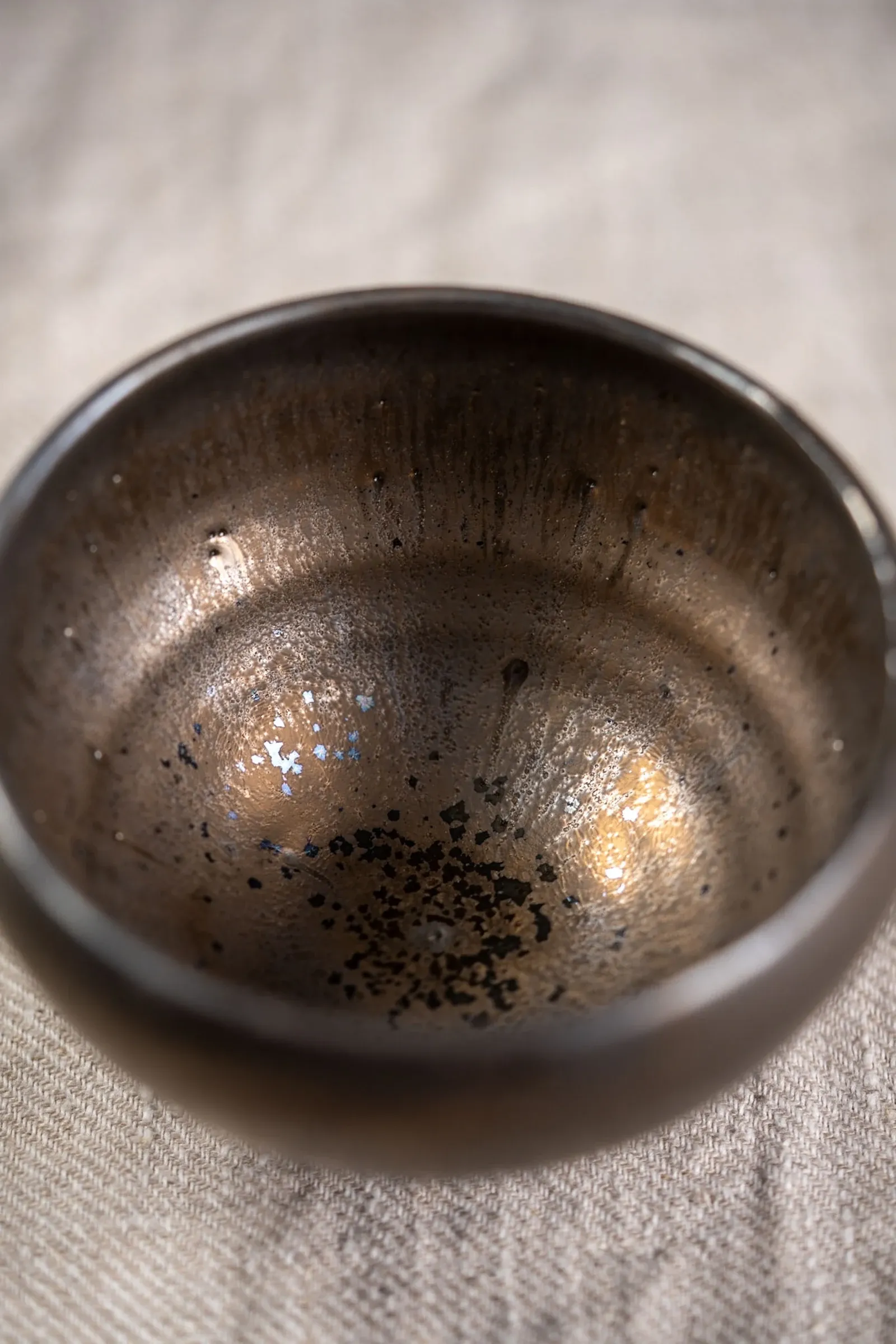 A bronze-glazed bowl from the current collection, seen from above